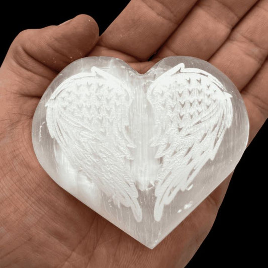 Ancient Infusions Selenite Carved Heart With Angel Wings - Front view, showcasing the divine harmony and purity of Selenite with angelic symbolism.