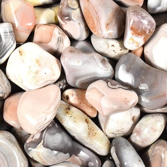 Close-up of banded agate stones, highlighting their spiritual meaning and uses in meditation and healing.