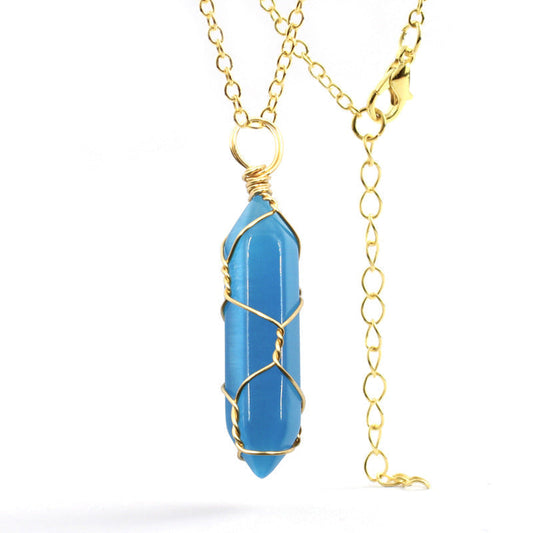 Close-up of a Blue Cat's Eye Necklace featuring a handcrafted gold wire-wrapped gemstone with a stainless steel chain.