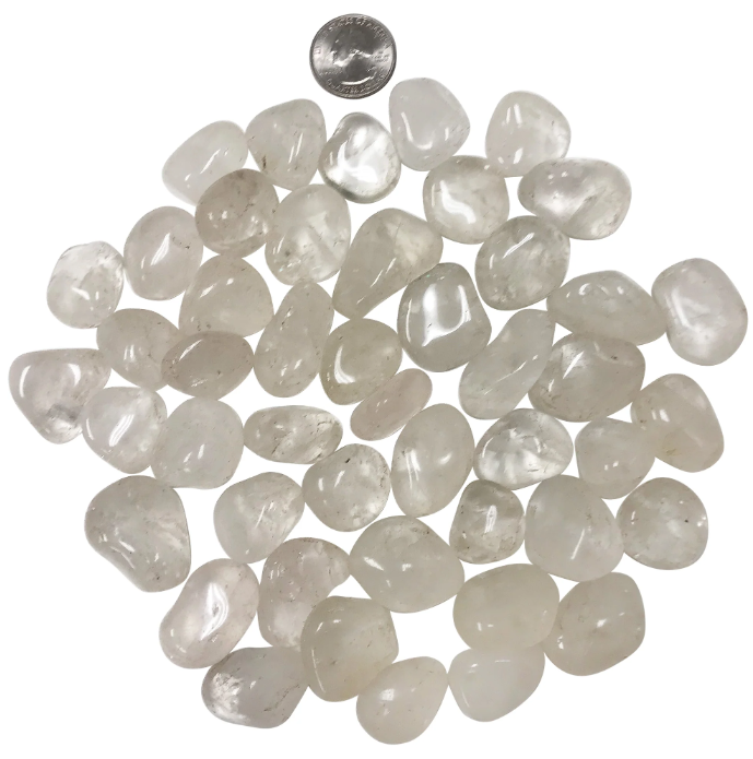 Close-up of polished clear quartz stones, highlighting their spiritual benefits and amplifying energy.