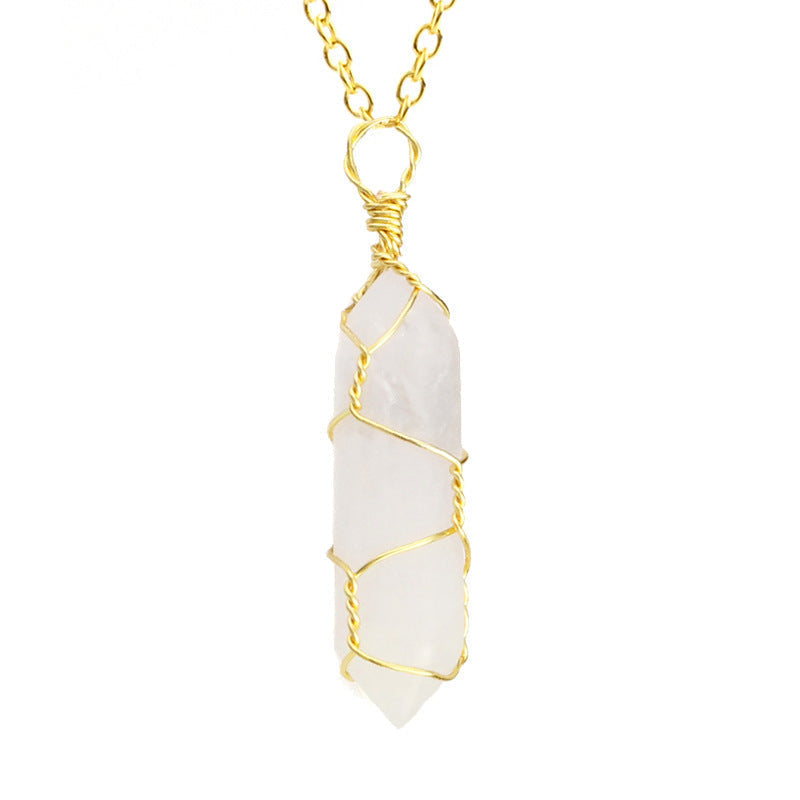 Close-up of a Crystal Quartz Necklace featuring a clear gemstone wrapped in handcrafted gold wire with a stainless steel chain.