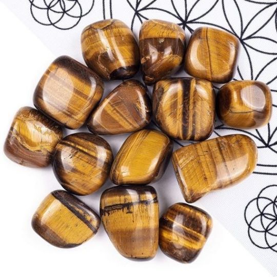 Yellow Tiger’s Eye tumbled stones available for sale, highlighting their value and healing energy.