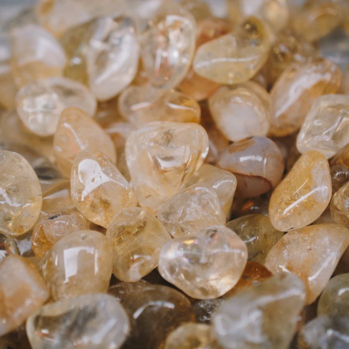 Natural Citrine tumbled stones ideal for new moon rituals, highlighting their abundance-attracting energy.