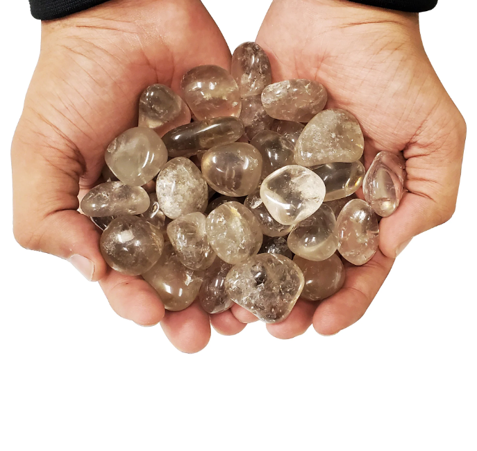 Large smoky quartz cluster with polished tumble stones for grounding and energy cleansing.