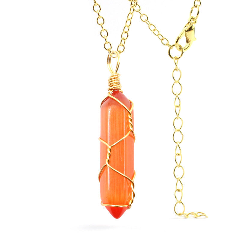 Close-up of an Orange Cat's Eye Necklace featuring a glowing gemstone wrapped in handcrafted gold wire with a stainless steel chain.