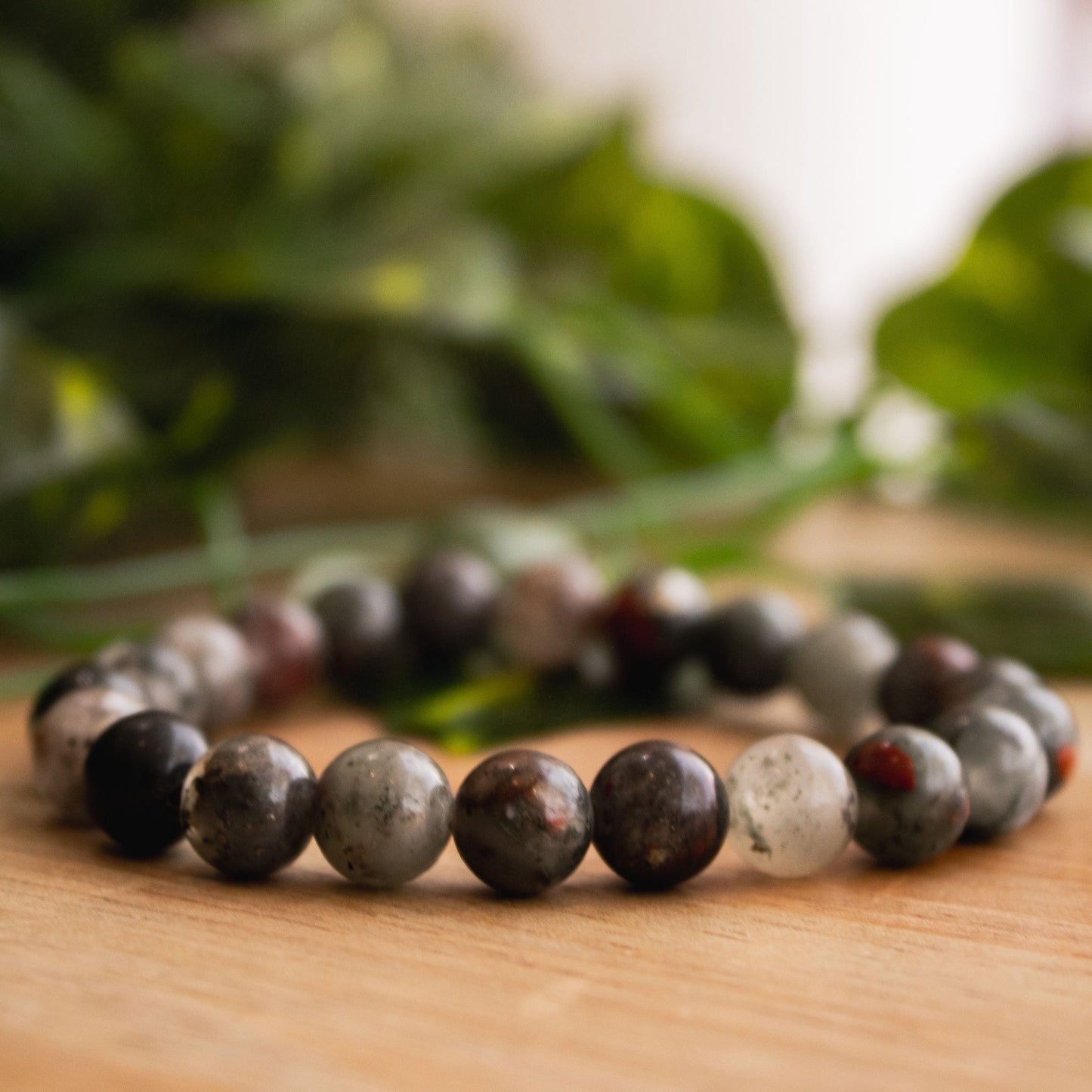 Close-up of Real Bloodstone Beaded Elastic Bracelet – Vibrant Red and Green Healing Crystal Jewelry.