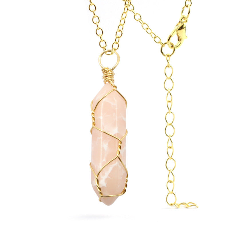 Close-up of a Rose Quartz Necklace featuring a soft pink gemstone wrapped in handcrafted gold wire with a stainless steel chain.