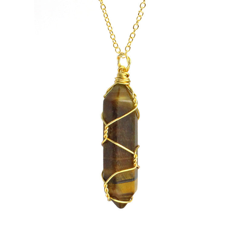 Close-up of a Tiger's Eye Necklace featuring a golden-brown gemstone wrapped in handcrafted gold wire with a stainless steel chain.