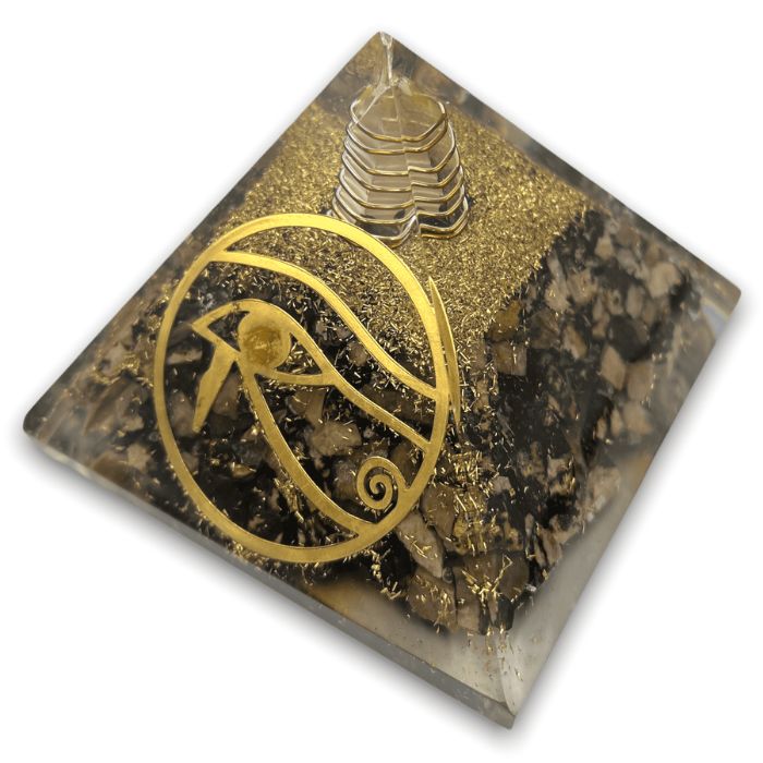 What is in an orgonite pyramid? Rhodonite crystals, resin, and metals.