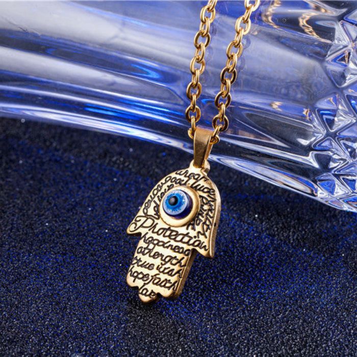 Women’s Gold and Silver Hamsa Evil Eye Pendant Necklace with Stainless Steel Chain by Ancient Infusions.